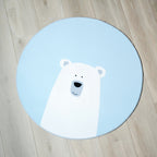 Et rundt blått teppe med isbjørn