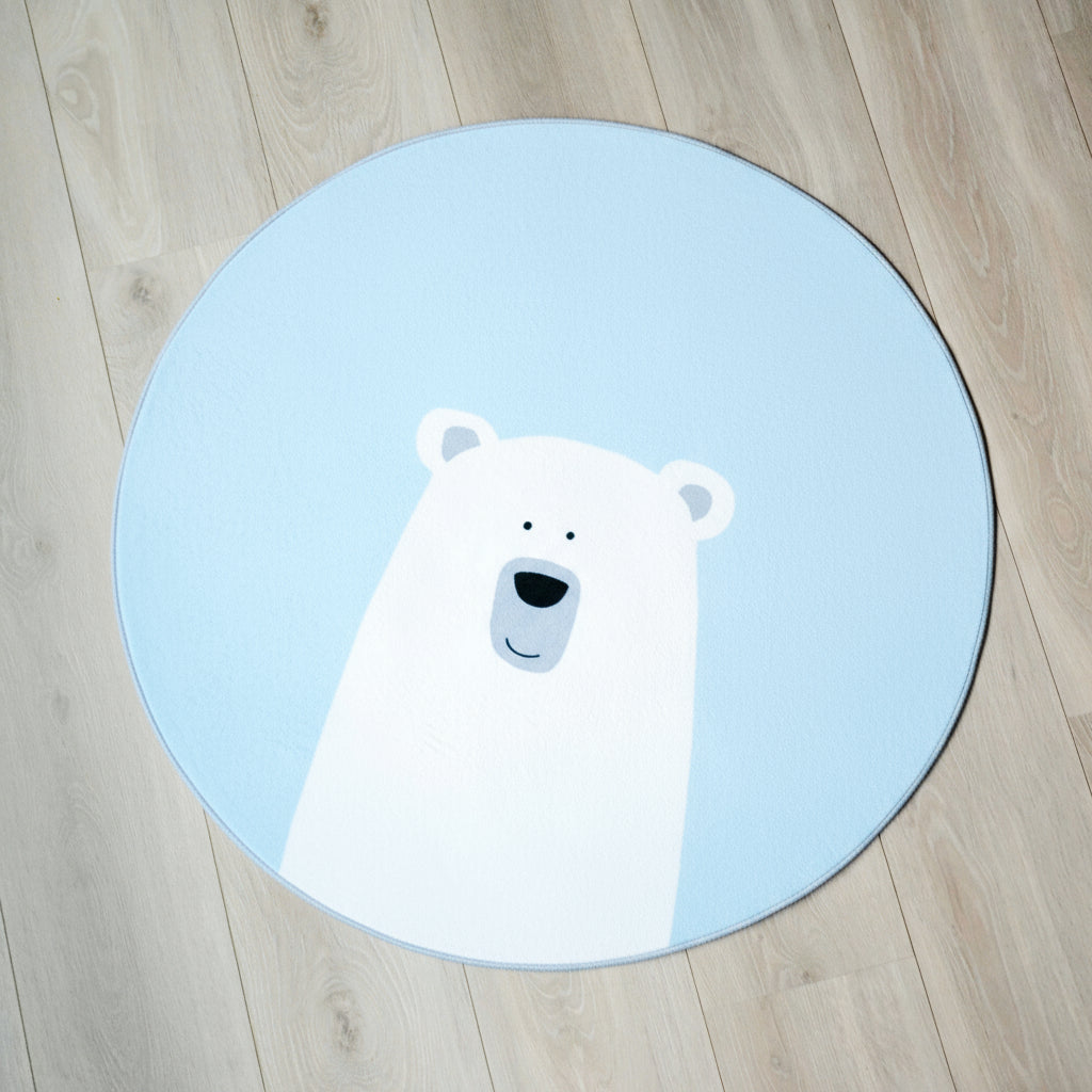 Et rundt blått teppe med isbjørn